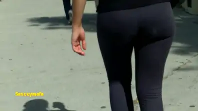 Juicy ass in black tights wiggling around candid camera
